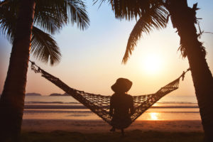 silhouette of woman in hat