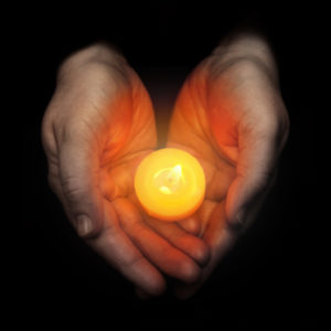 istock_handsholdingcandle_extrasmall